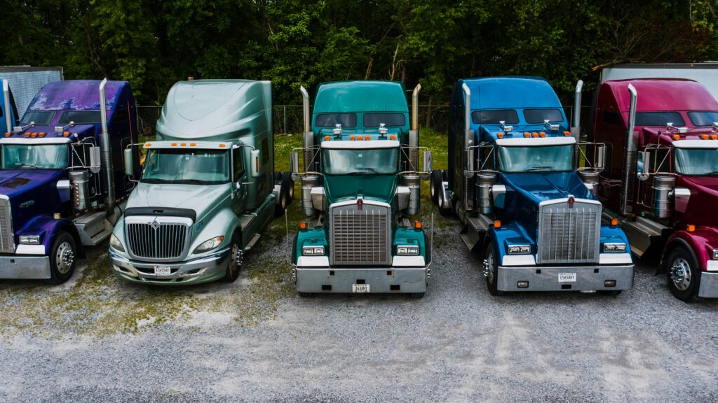 Auto carriers standing in line for loading.